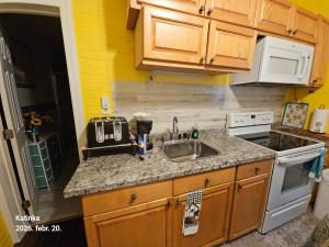 a kitchen with a sink and a counter top at 2#studio In Clearwater usa in Clearwater +11 photos