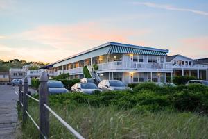 a large building with cars parked in front of it at The Edgewater in Old Orchard Beach