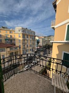 a balcony with a view of a city with buildings at Appartamento Bixio sul porto in Sanremo