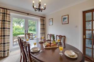 a dining room with a table and chairs and a window at 3 Bed in Ravenscar oc-sa397 in Ravenscar