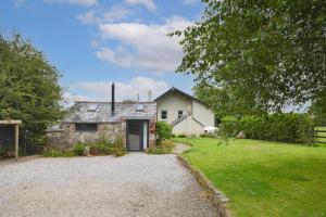 an old stone house with a gravel driveway at 4 Bed in St. Wenn oc-p00886 in Saint Wenn
