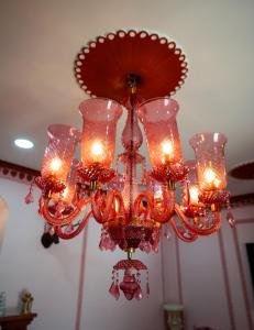 a chandelier is hanging from a ceiling at Fort Jangaldhar in Bikaner