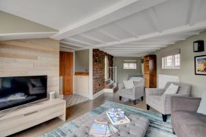 a living room with a couch and a television at 3 Bed in Fowey oc-p00647 in Fowey