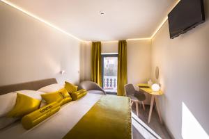 Ein Bett oder Betten in einem Zimmer der Unterkunft Hotel Vinotel Gospoja