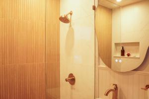 a bathroom with a shower and a mirror at The Perch Hotel in East Windham +30 photos
