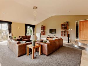 a living room with two couches and a television at 6 Bed in Morpeth oc-91805 in Ellington