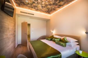 Ein Bett oder Betten in einem Zimmer der Unterkunft Hotel Vinotel Gospoja