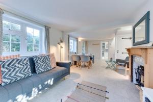 a living room with a couch and a fireplace at 2 Bed in Sweffling oc-whcs in Rendham