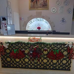 a counter with christmas ornaments on it at Hotel Sir Colentina in Bucharest