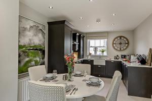 a kitchen and dining room with a table and chairs at 3 Bed in Kirkby Stephen oc-c29217 in Kirkby Stephen