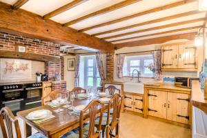 a kitchen with a table and chairs in a room at 3 Bed in Gressenhall oc-o28417 in East Dereham +13 photos