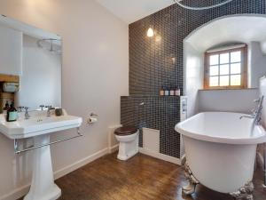 a white bathroom with a sink and a toilet at 5 Bed in Selkirk oc-tower in Selkirk +29 photos