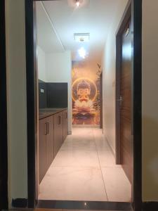 a hallway with a painting on the wall at Hotel Jayaswal INN in Bharbharia