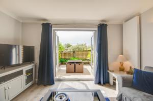 a living room with a couch and a tv at 2 Bed in Fowey oc-p00857 in Fowey +7 photos
