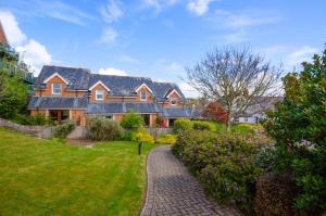 a large house with a brick walkway in a yard at 2 Bed in Fowey oc-p00857 in Fowey