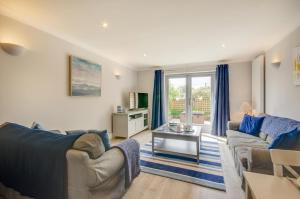 a living room with two couches and a table at 2 Bed in Fowey oc-p00857 in Fowey