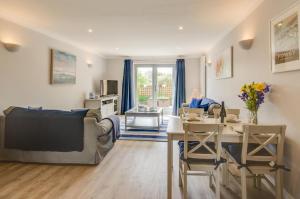 a person sitting in a chair in a living room at 2 Bed in Fowey oc-p00857 in Fowey