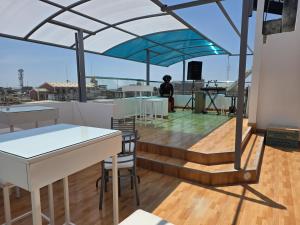 a person is standing on the roof of a building at Hotel Venture in Chincha Alta