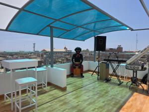 a person standing on the roof of a building at Hotel Venture in Chincha Alta