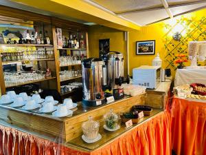 a coffee shop with a counter top with a counter top at Hostal La Posada De La Abuela in La Paz +75 photos