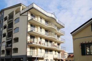 a tall apartment building with balconies on it at WI-RO Carminati - Mare e relax in Marina di Andora