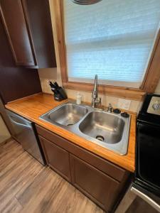 a kitchen with a sink and a window at Cottage No 4 on Ranch in McKinney