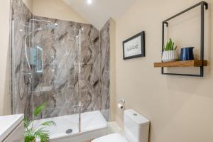 a bathroom with a shower and a toilet at 2 Bed in Wycliffe oc-r29947 in Wycliffe +30 photos