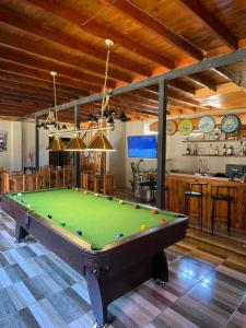 a pool table in the middle of a room at Casona Pretton in Valparaíso