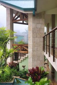 a house with a staircase in a garden at Hotel Mi Linda Tierra in Quesada