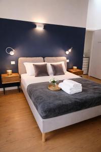 a bedroom with a large bed with a table on it at Casa di Mirea in Grado