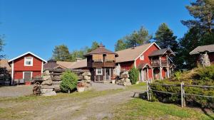 a group of homes with red and brown at Lapuanjoen Rantakeidas in Voltti