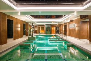a large swimming pool in a hotel lobby at The Grand, York in York