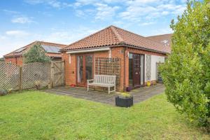 a brick house with a bench in a yard at 2 Bed in Barnby oc-t28265 in North Cove