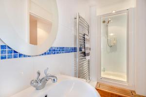 a bathroom with a sink and a mirror and a shower at 2 Bed in Barnby oc-t28265 in North Cove +15 photos