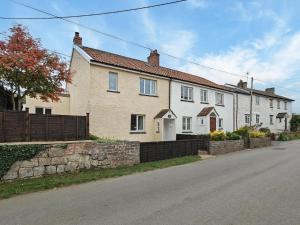a row of houses on the side of a street at 2 Bed in Middlezoy oc-s33601 in Middlezoy