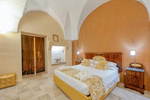 a bedroom with a large bed in a room at Corte Piri in Tricase