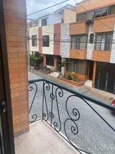a balcony with a view of a building at Siéntete en casa 2 in Pasto