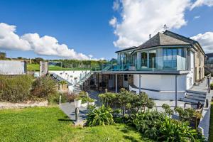 a house with a glass roof and a yard at 5 Bed in St. Issey oc-r4328 in Saint Issey