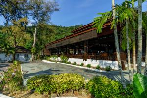 a building with a patio in front of it at Perhentian Island Resort in Perhentian Islands