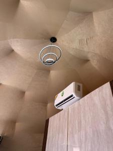 a ceiling with a ceiling light and a air conditioner at Wadi rum camp teem in Wadi Rum