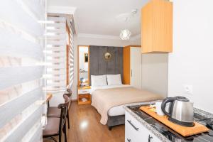 a bedroom with a bed and a desk in a room at Aras Life Hotel in Istanbul