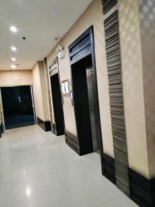 a hallway of a hotel with two elevators and doors at JY7 Rooms 414 in Cebu City