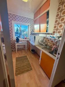 a small kitchen with a sink and a counter at Sea View apartment in Askøy