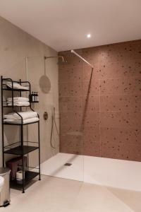 a shower with a glass door in a bathroom at Casa Diez in Estepona