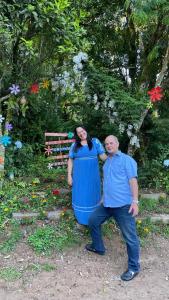 a man and a woman posing for a picture at Pousada Recanto Gramado in Gramado