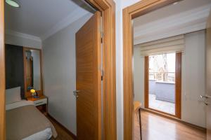 a bedroom with a bed and a large window at Aras Life Hotel in Istanbul +86 photos