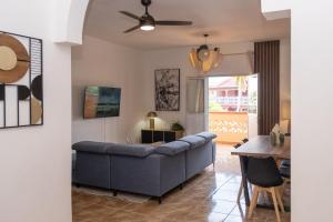 a living room with a couch and a table at T4 Oasis tropicale x Nawassi in Pamandzi