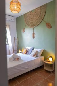 a bedroom with a bed with a ladder and two lamps at T4 Oasis tropicale x Nawassi in Pamandzi