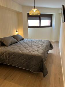 a bedroom with a bed and a window at Lorenzo in Benaguacil