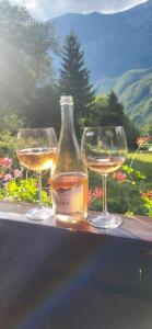 three glasses of wine sitting on a table at Počitniško stanovanje PLANJA in Soča